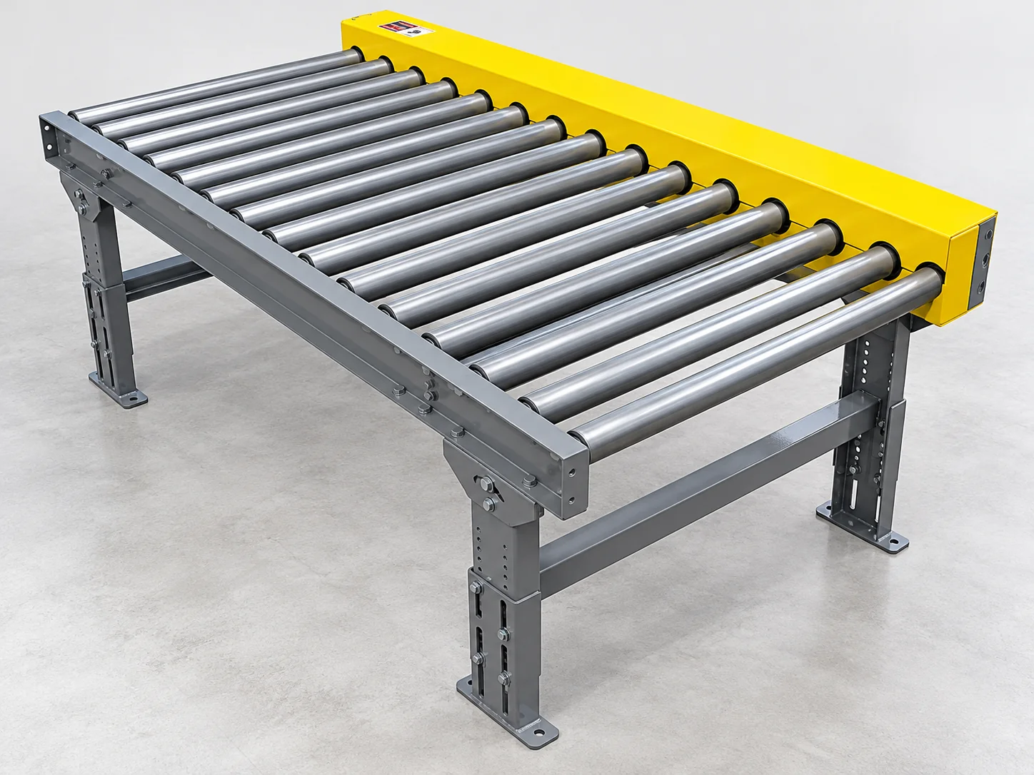 Chain-driven live roller pallet conveyor with steel rollers and yellow drive guard